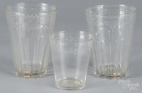Three engraved flip glasses, 19th c., 6'' h. and 4 1/2'' h.