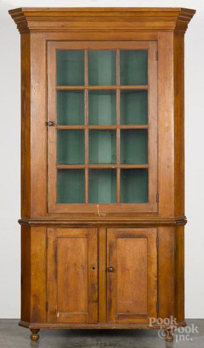Pennsylvania pine two-part corner cupboard, ca. 1830, 88'' x 44''.