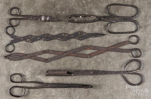 Iron scissor utensils, 19th c., to include accordion tongs, a snuffer, etc.