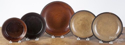 Five redware plates/shallow bowls, 19th c., largest - 9'' dia.