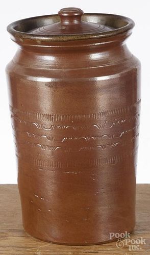 Redware lidded crock, 19th c., with incised banding, 9 3/4'' h.