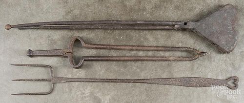 Cast iron waffle iron, 19th c., together with fireplace tongs and a fork, longest - 28 1/4''.