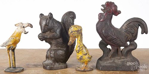 Four cast iron doorstops/weights, ca. 1900, to include a squirrel, a rooster, a duck, and a cockatiel