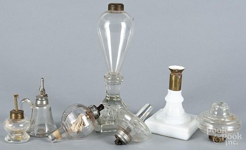 Two Sandwich glass fluid lamps, 19th c., together with two small desk lamps and two fonts