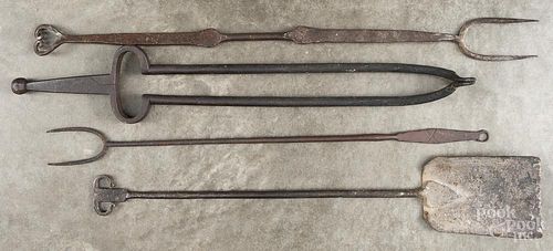 Cast iron fire tongs, 19th c., together with two forks and a shovel, longest - 29 1/4''.