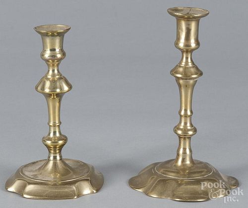 Two George II brass candlesticks, mid 18th c., 6 1/4'' h. and 7'' h.