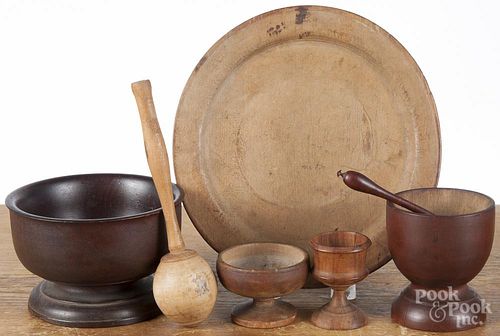 Woodenware, 19th c., to include a plate, salts, a rattle, etc.
