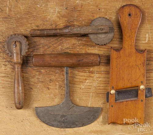Two wood jagging wheels, 19th c., together with a slaw cutter and chopper.