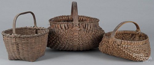 Three split oak baskets 19th c., largest - 12'' x 16''.