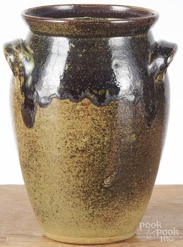 Redware storage jar, 20th c., with a green and brown drip glaze, 7 1/2'' h.