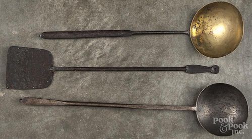 Three wrought iron utensils, 19th c., to include two ladles and a turner, longest - 21 1/2''