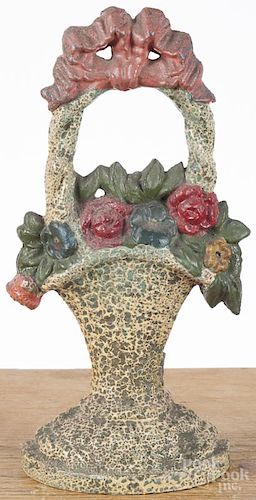 Painted cast iron floral basket doorstop, ca. 1900, 11 1/2'' h.