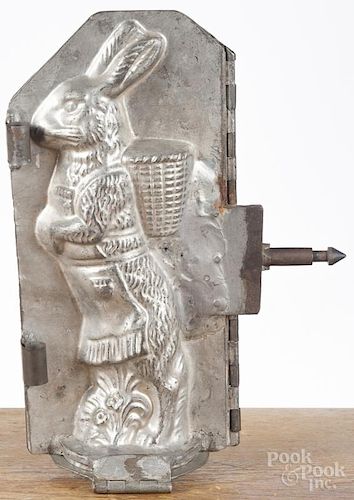 Five tin rabbit candy molds, early 20th c., tallest - 12 1/4''.