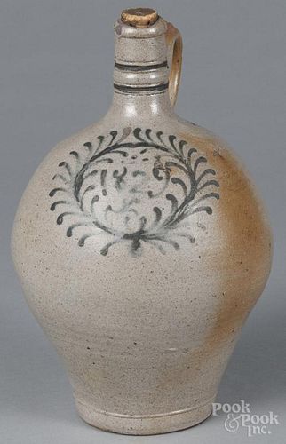 German stoneware ovoid jug, dated 1829, within a cobalt floral wreath, 11'' h.