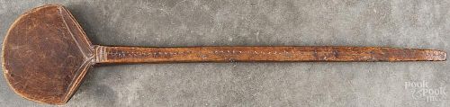 Carved wooden dipper, 19th c., 20 1/2'' l., together with a continental iron fat lamp, 8 3/4'' h.