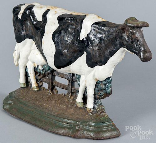 Painted cast iron cow doorstop, late 20th c., 9'' h.