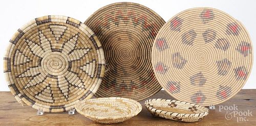 Five Native American Indian baskets and trays, 20th c., largest - 14 1/2'' dia.