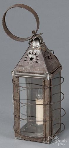Tin carry lantern, 19th c., with punched star and sunrise panels, 15 3/4'' h.