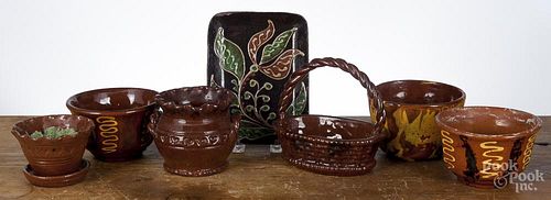 Seven pieces of contemporary redware, to include three Breininger bowls, a basket