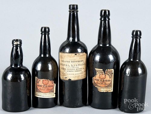 Five dark amber glass liquor bottles, 19th c., to include two with Robert Byass labels