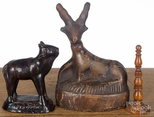 Chalkware stag, together with a redware cow and a turned fruitwood sewing pick, tallest - 5 3/4''.