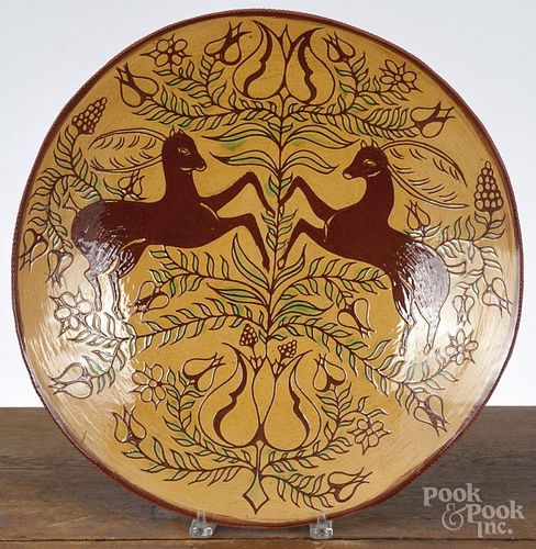 Foltz sgrafitto redware charger, 17 3/4'' dia. Provenance: The Estate of Mark and Joan Eaby