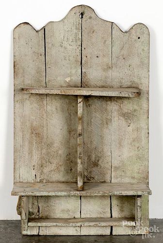 Primitive painted pine hanging shelf, late 19th c., retaining an old green surface, 31'' h., 18'' w.