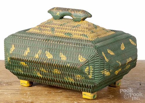 Carved and painted tramp art box, early 20th c., retaining an old green and yellow surface, 7'' h.
