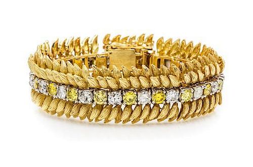 An 18 Karat Yellow Gold, Platinum, Colored Diamond and Diamond Bracelet, 57.50 dwts.