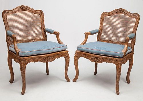 Pair of Early Louis XV Style Beechwood and Caned Fauteuils à La Reine