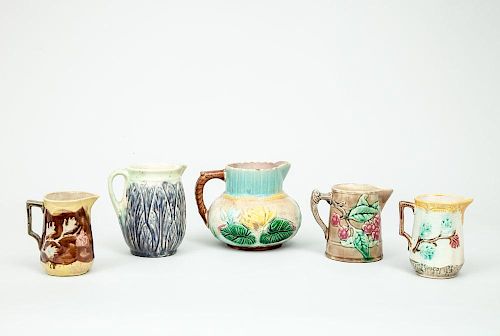 Five English Relief-Decorated Majolica Pitchers
