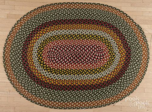 Oblong braided rug, 6'9'' x 5'. Provenance: The Estate of Mark and Joan Eaby, Brownstown, Pennsylvania