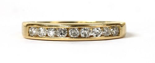 A gold diamond half eternity ring,