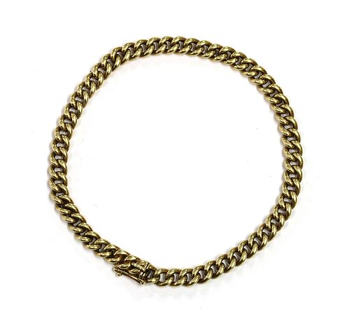 A gold curb link bracelet,