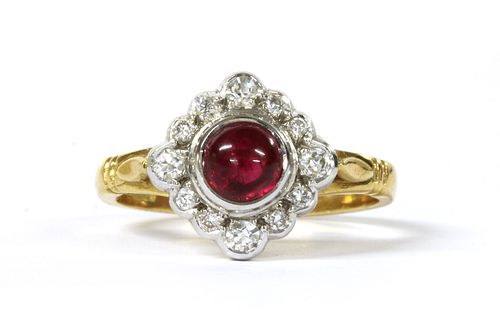 An 18ct gold ruby and diamond off set square cluster ring,