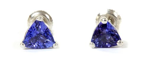 A pair of white gold single stone tanzanite stud earrings,