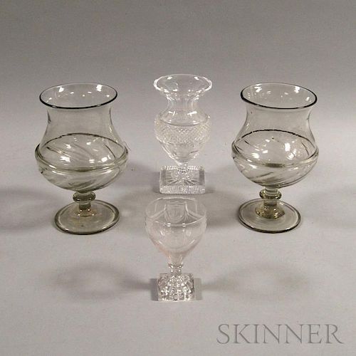 Four Colorless Glass Vessels