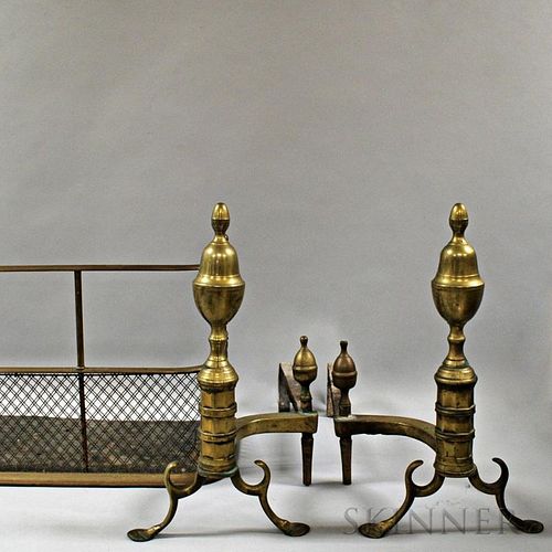 Pair of Brass and Iron Acorn-top Andirons and a Fireplace Fender