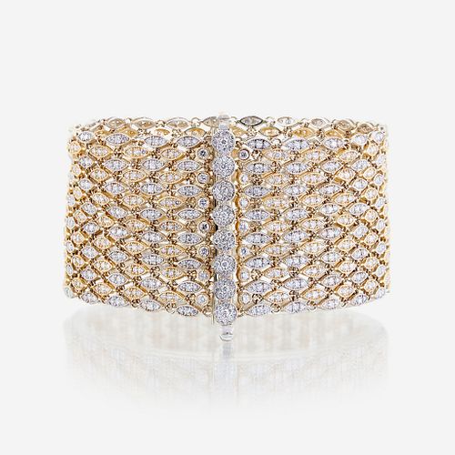 A bicolor fourteen karat gold and diamond bracelet