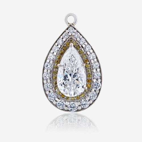 A diamond, colored diamond, and ten karat white gold pendant