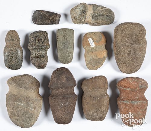 Various Native American stone axe heads, etc.