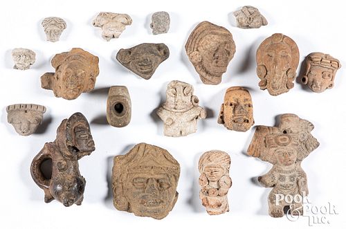 Ancient fragmentary carved heads and figures