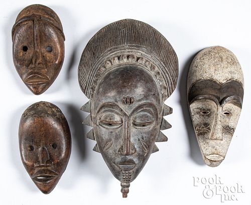Four African tribal carved wood masks