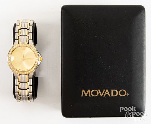 Movado wristwatch in box.