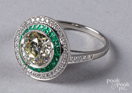 Platinum, diamond, and emerald ring