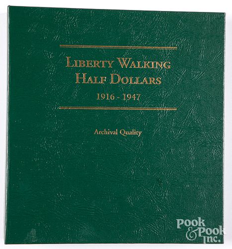 Forty-six Walking Liberty silver half dollars.