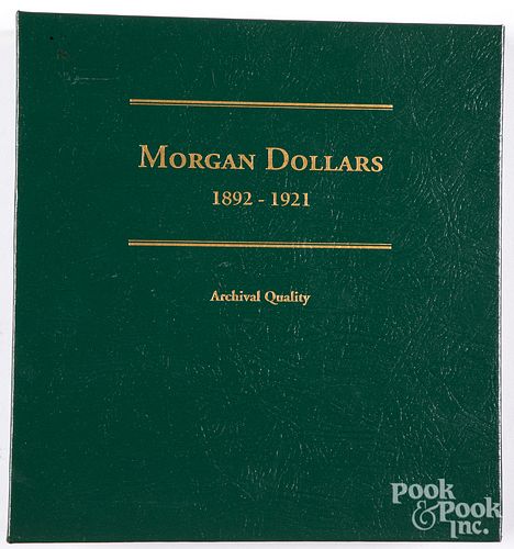 Twenty-four Morgan silver dollars. 1892-1921.