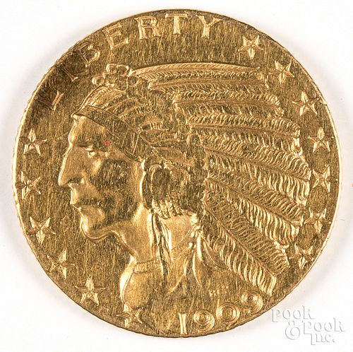 1909 five dollar Indian Head gold coin.