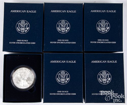 Five American Eagle 1ozt fine silver coins.