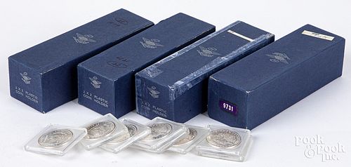 Ninety-eight 1879-S Morgan silver dollars.